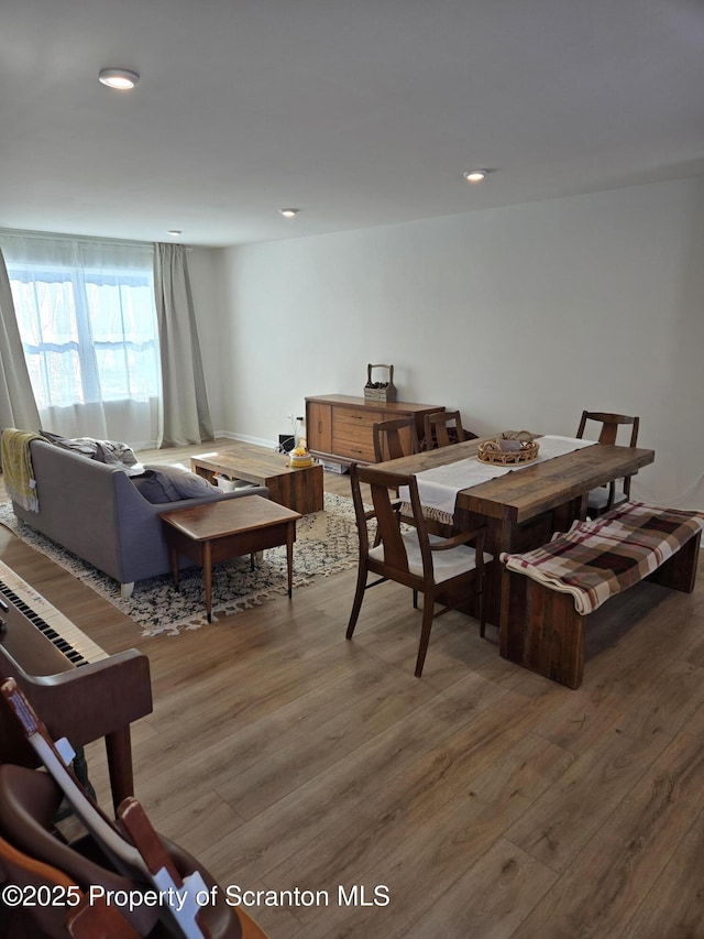 dining space featuring hardwood / wood-style flooring