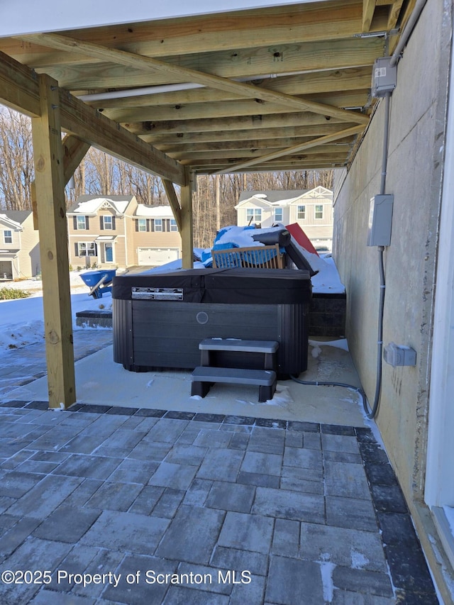 view of patio / terrace with a hot tub