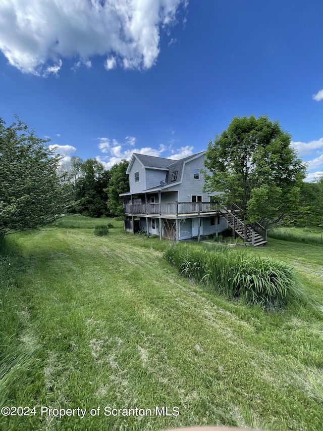 view of yard featuring a wooden deck