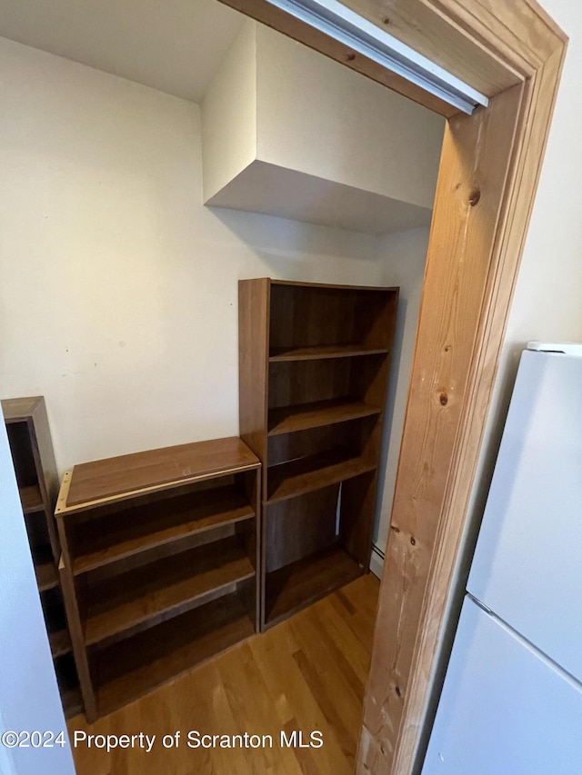 interior space featuring hardwood / wood-style floors and white fridge