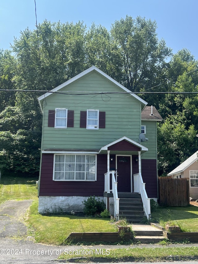 view of front of property with a front lawn