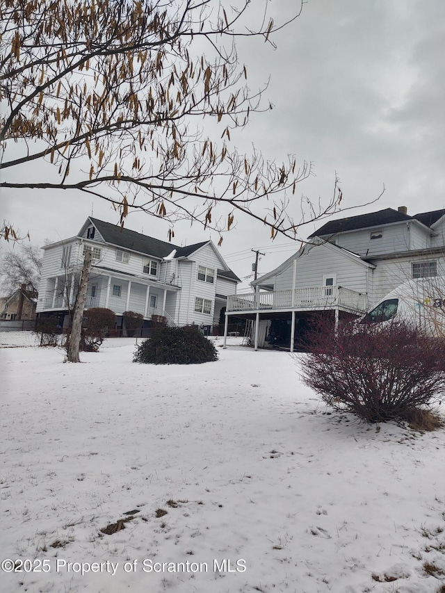 view of snow covered house