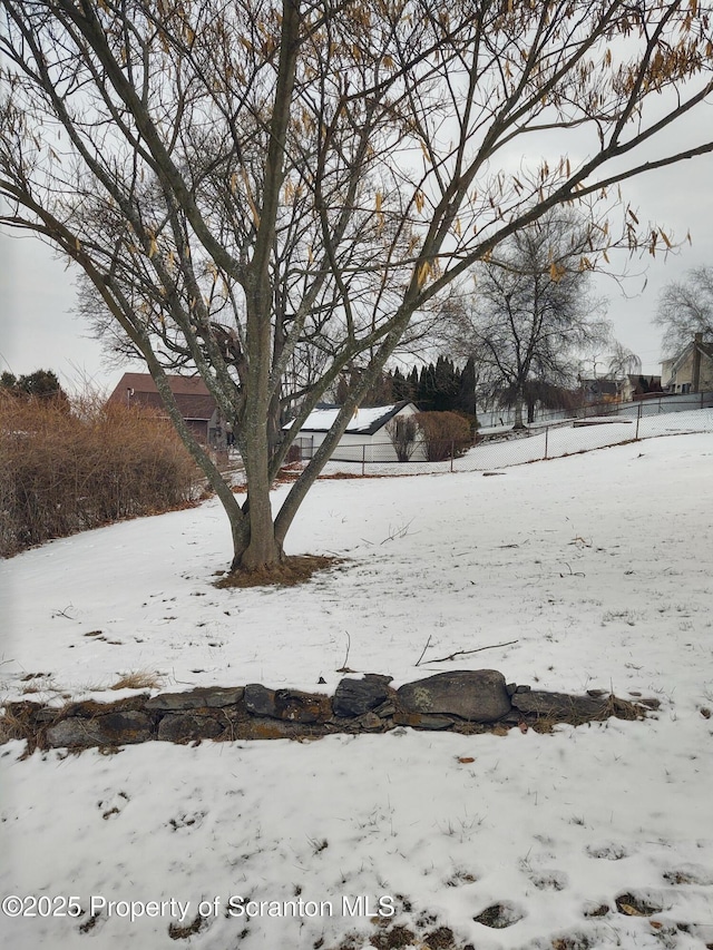 view of yard layered in snow