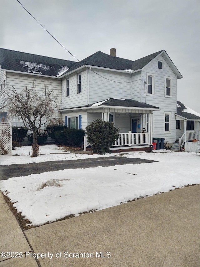 view of front property featuring covered porch