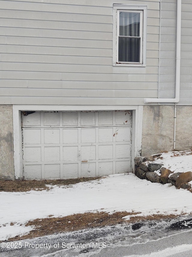 view of snow covered garage