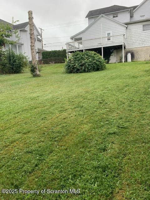 view of yard with a wooden deck