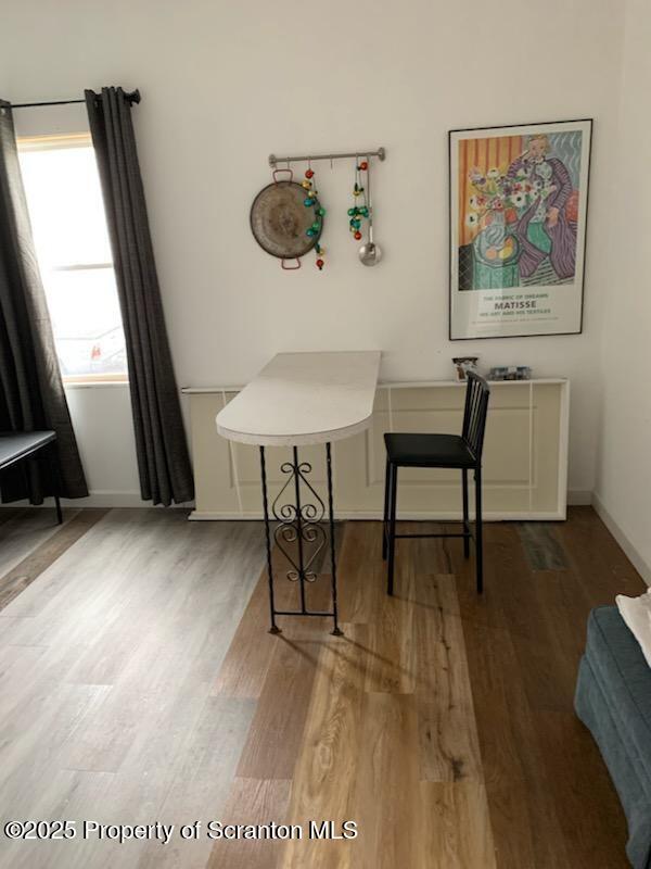 home office featuring hardwood / wood-style flooring