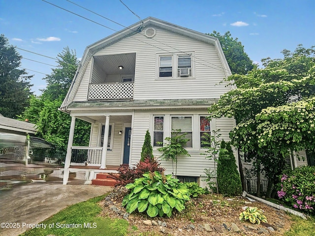 510 Moltke Ave, Scranton, PA 18505 - colonial inspired home with covered porch, a gambrel roof, cooling unit, and a balcony