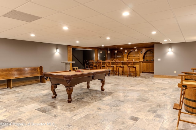 rec room with bar and pool table