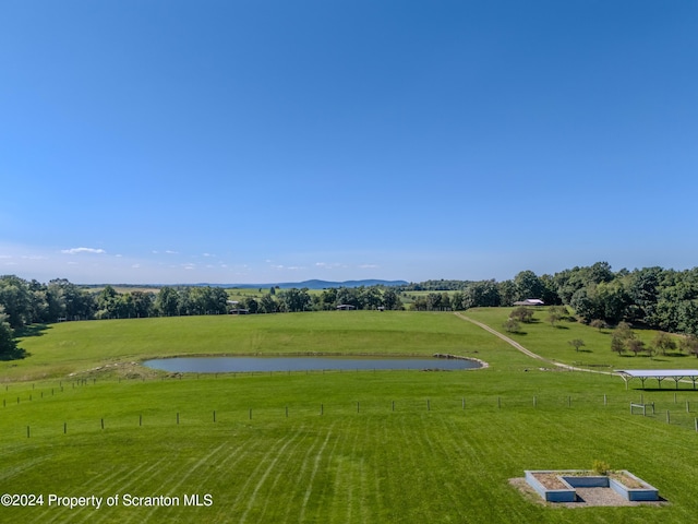 aerial view featuring a rural view and a water view