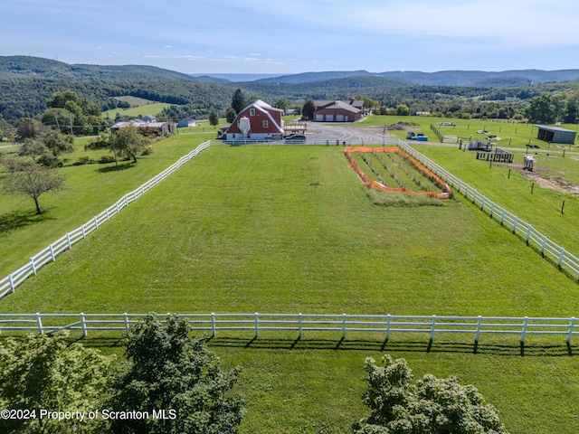 birds eye view of property featuring a mountain view and a rural view