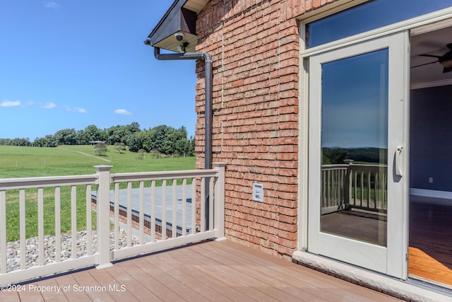 wooden terrace with a rural view