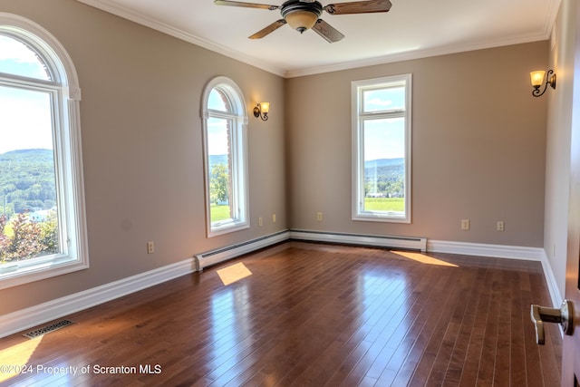 unfurnished room featuring dark hardwood / wood-style floors, baseboard heating, ceiling fan, and ornamental molding