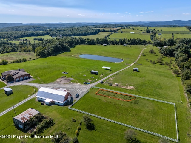 drone / aerial view featuring a water view and a rural view