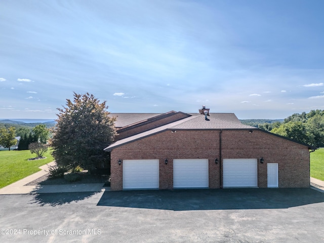 view of side of property with a garage