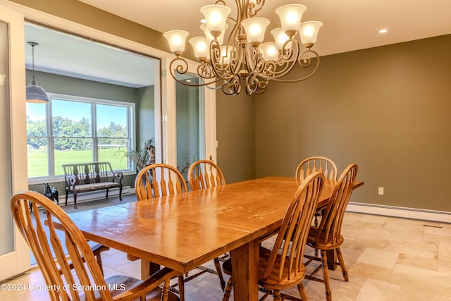 dining area featuring baseboard heating and a notable chandelier