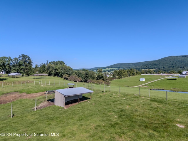 view of mountain feature with a rural view