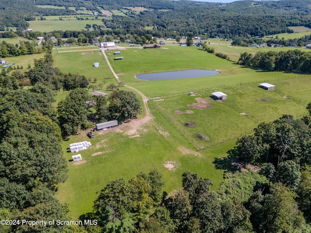 birds eye view of property featuring a rural view and a water view