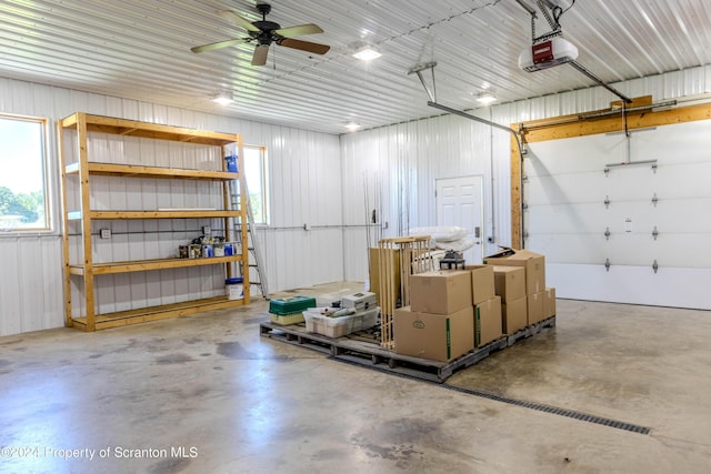 garage with ceiling fan and a garage door opener