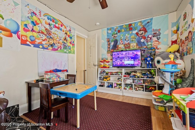 game room featuring wood finished floors and a ceiling fan