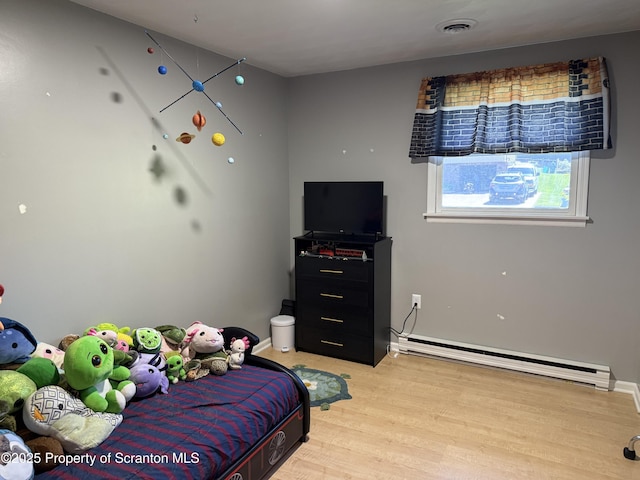 102 Bubernak Blvd, Old Forge, PA 18518 - bedroom featuring baseboard heating, light wood finished floors, and baseboards