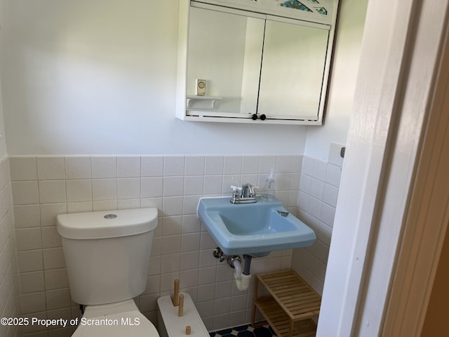 102 Bubernak Blvd, Old Forge, PA 18518 - half bath featuring tile walls, a wainscoted wall, toilet, and a sink