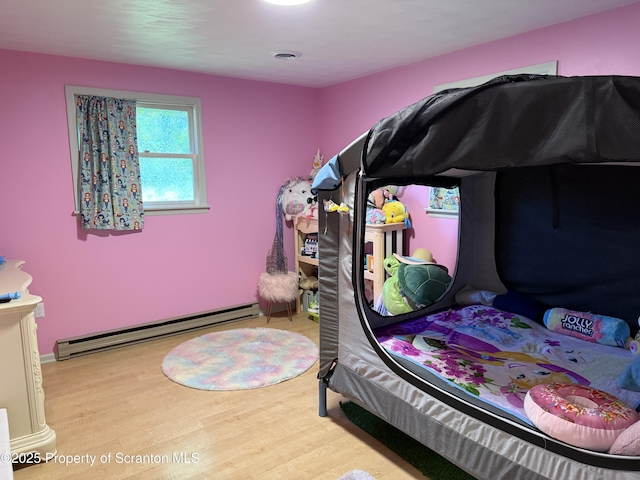 102 Bubernak Blvd, Old Forge, PA 18518 - bedroom with baseboard heating and wood finished floors