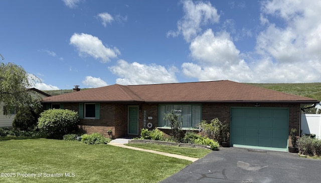 102 Bubernak Blvd, Old Forge, PA 18518 - ranch-style house featuring brick siding, an attached garage, asphalt driveway, a front yard, and roof with shingles