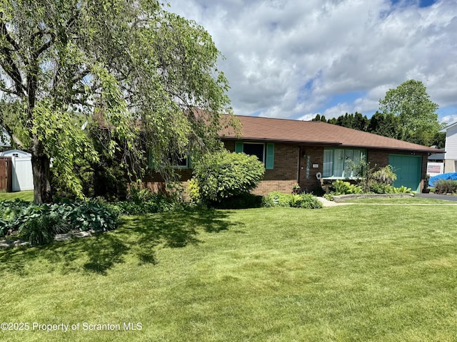 102 Bubernak Blvd, Old Forge, PA 18518 - view of front of property with brick siding, an attached garage, and a front yard