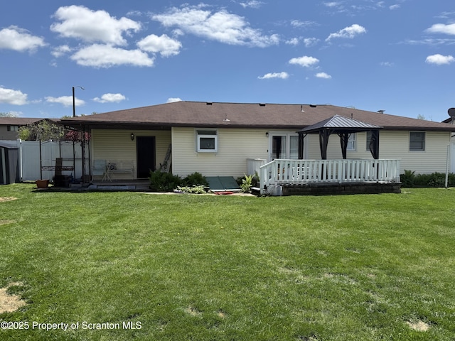 102 Bubernak Blvd, Old Forge, PA 18518 - back of property with a gazebo, a wooden deck, and a yard