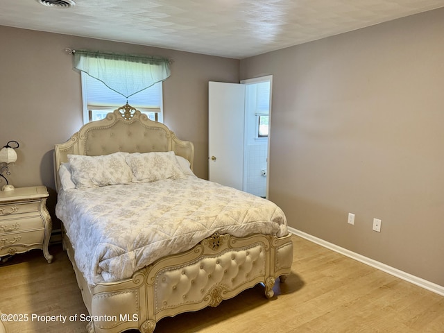 102 Bubernak Blvd, Old Forge, PA 18518 - bedroom with multiple windows, wood finished floors, and baseboards
