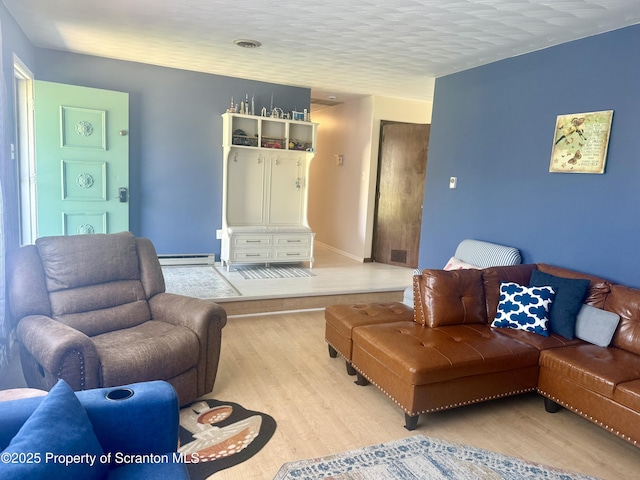 102 Bubernak Blvd, Old Forge, PA 18518 - living area with light wood-type flooring and a baseboard radiator