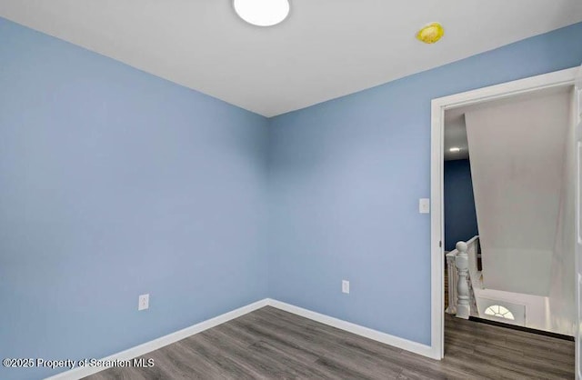 empty room featuring dark hardwood / wood-style flooring