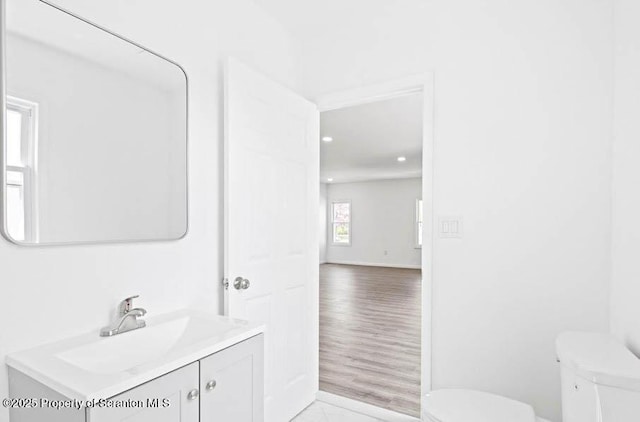 bathroom with vanity and toilet