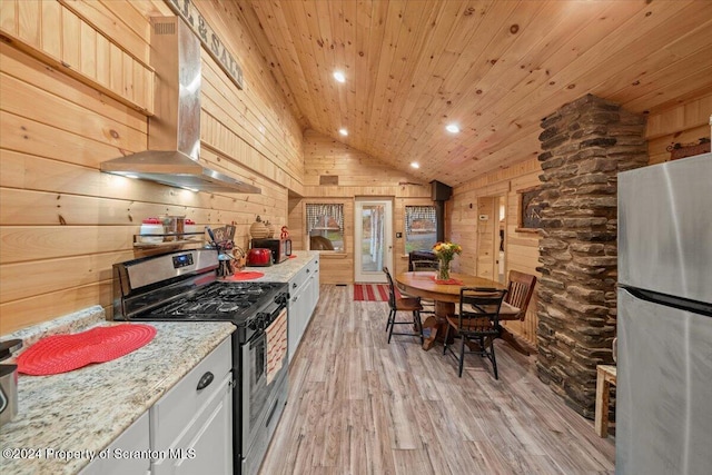 kitchen featuring stainless steel appliances, ventilation hood, wooden walls, wood ceiling, and light wood-type flooring