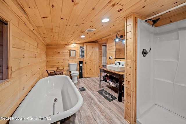 full bathroom featuring hardwood / wood-style floors, wood walls, sink, toilet, and wood ceiling