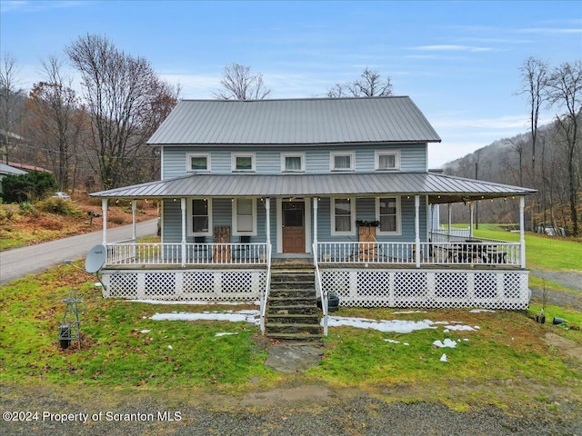 country-style home featuring a porch