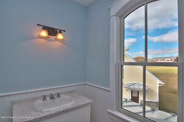 bathroom with vanity and a healthy amount of sunlight