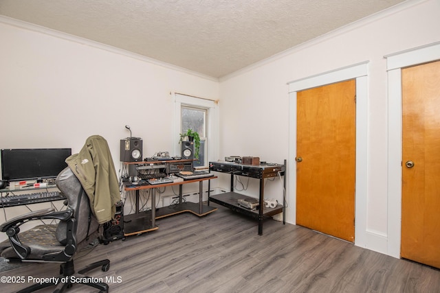 office with hardwood / wood-style flooring, crown molding, and a textured ceiling