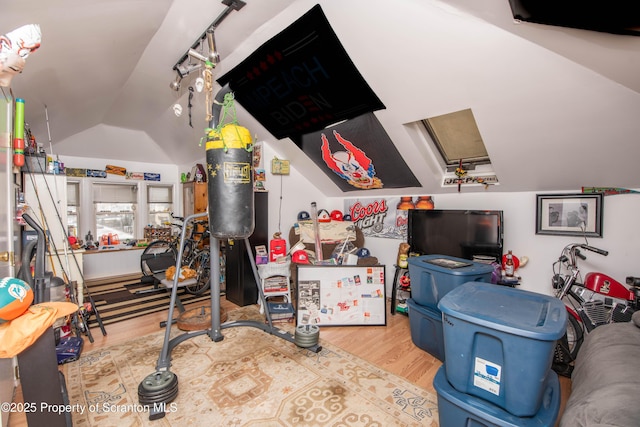 interior space featuring vaulted ceiling and hardwood / wood-style floors