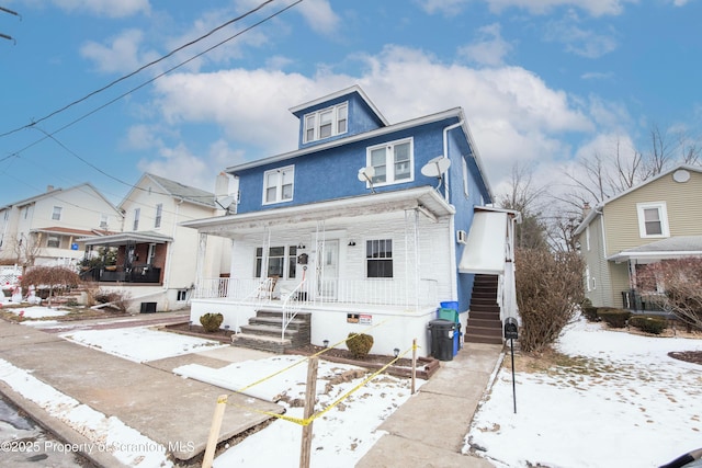 view of front property featuring covered porch