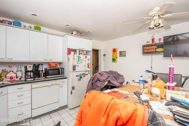 kitchen featuring light tile patterned flooring, ceiling fan, white cabinets, and white appliances