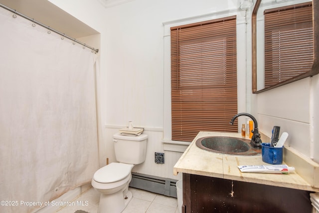 bathroom featuring vanity, a baseboard heating unit, tile patterned floors, and toilet