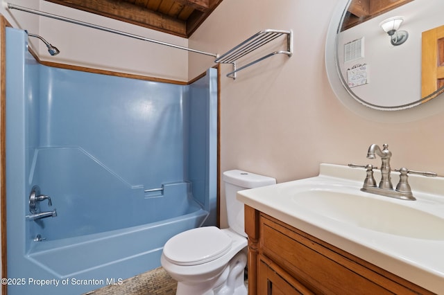 bathroom with toilet, vanity, and bathing tub / shower combination