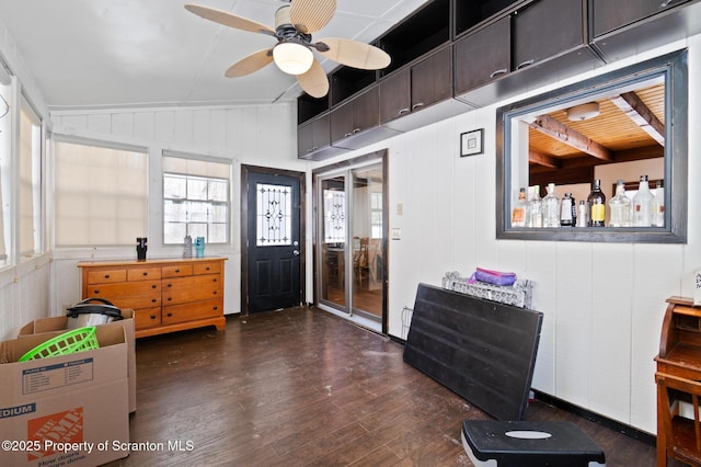 entrance foyer featuring vaulted ceiling, dark wood finished floors, and a ceiling fan