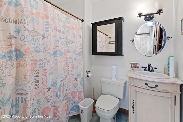 bathroom with a shower with shower curtain, vanity, and toilet