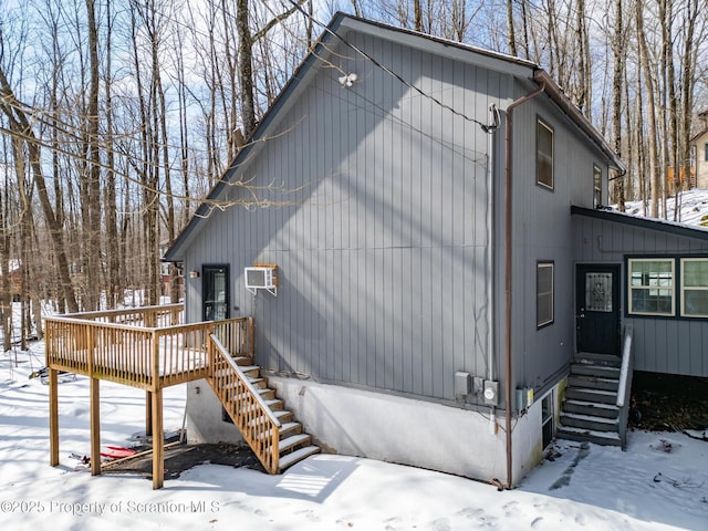 exterior space with stairs and a deck