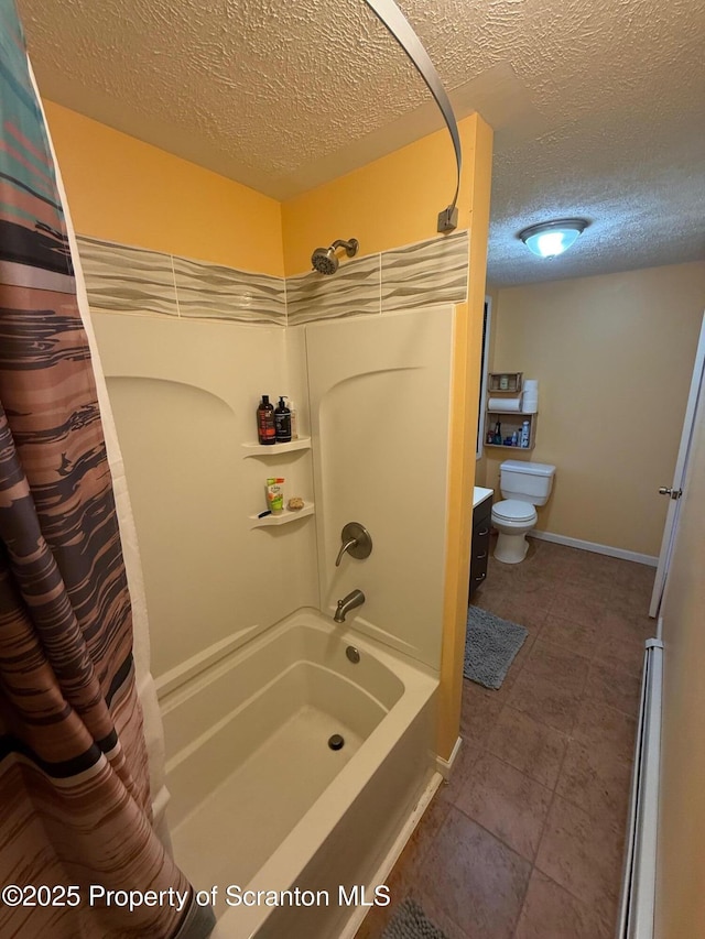 full bathroom with vanity, shower / tub combo, toilet, and a textured ceiling