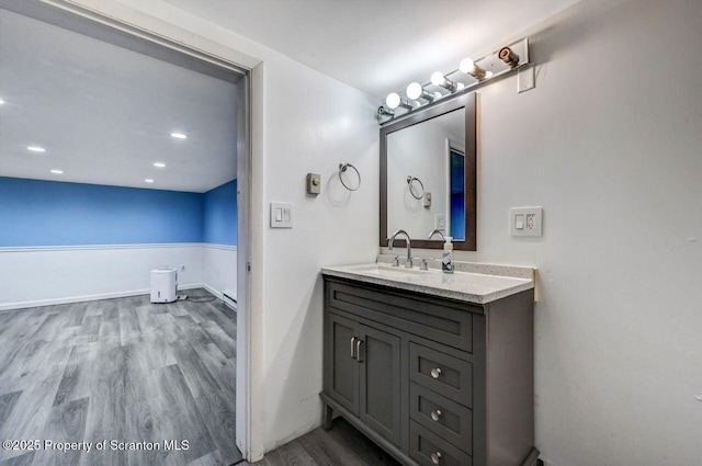 211 Hill St, Dupont, PA 18641 - bathroom with wood finished floors, vanity, and recessed lighting