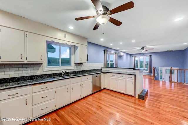 211 Hill St, Dupont, PA 18641 - kitchen featuring stainless steel dishwasher, ceiling fan, backsplash, a peninsula, and light wood finished floors